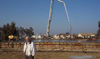 Man in front of construction crane