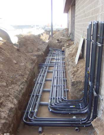 Organised clusters of pipes in a trench