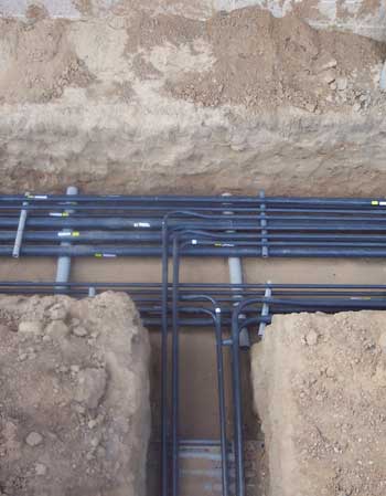 Organised clusters of pipes in a trench