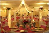 Function room decorated for a wedding (center)