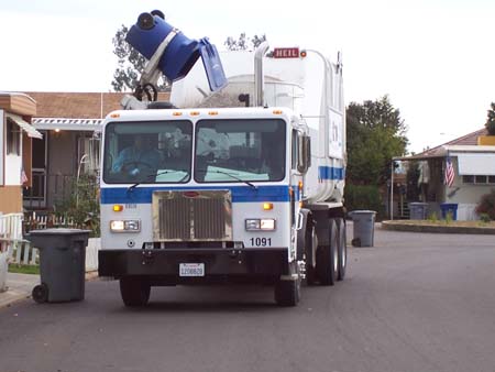 Recycling truck emptying a bin